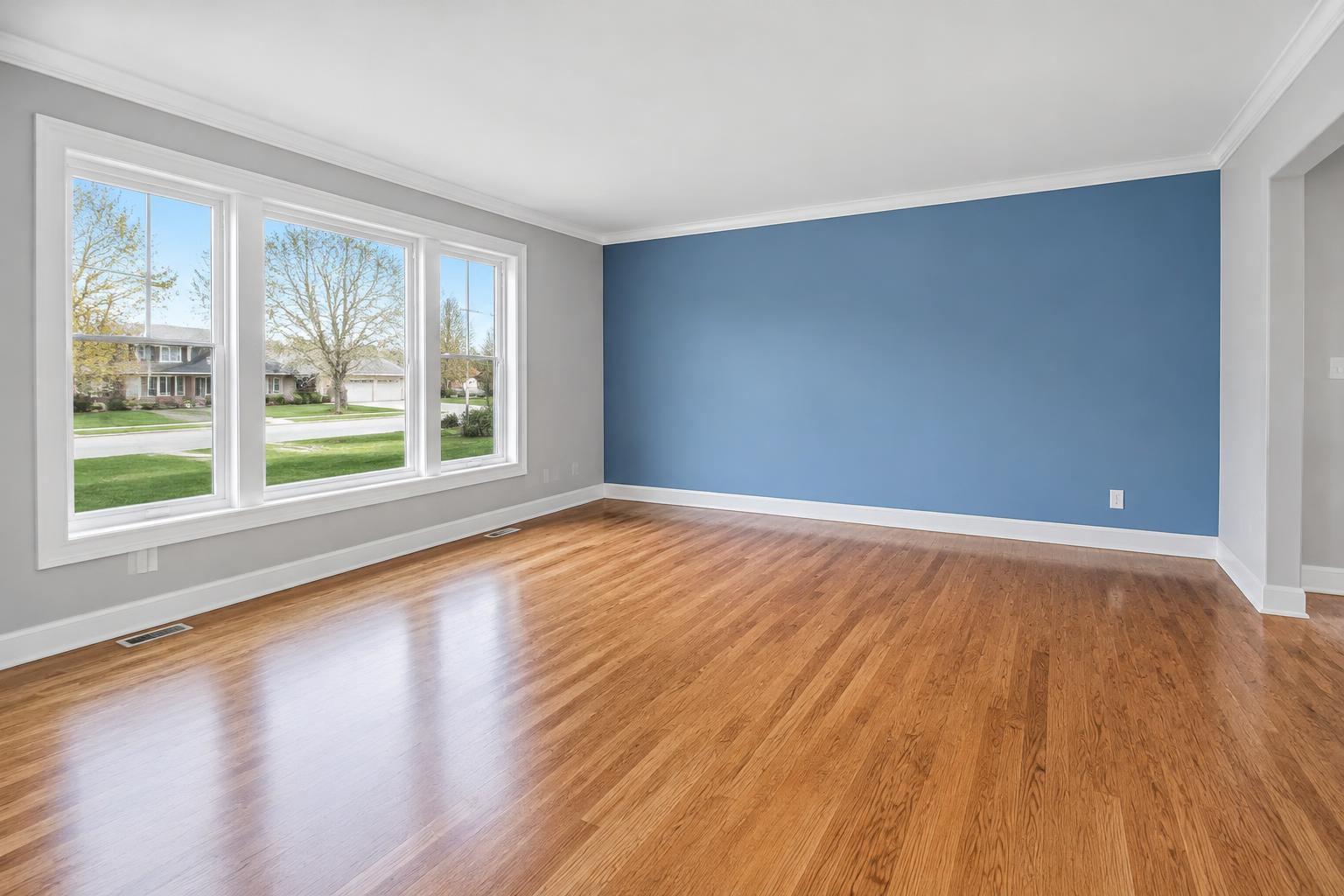 Illustrative painted room with blue accent wall